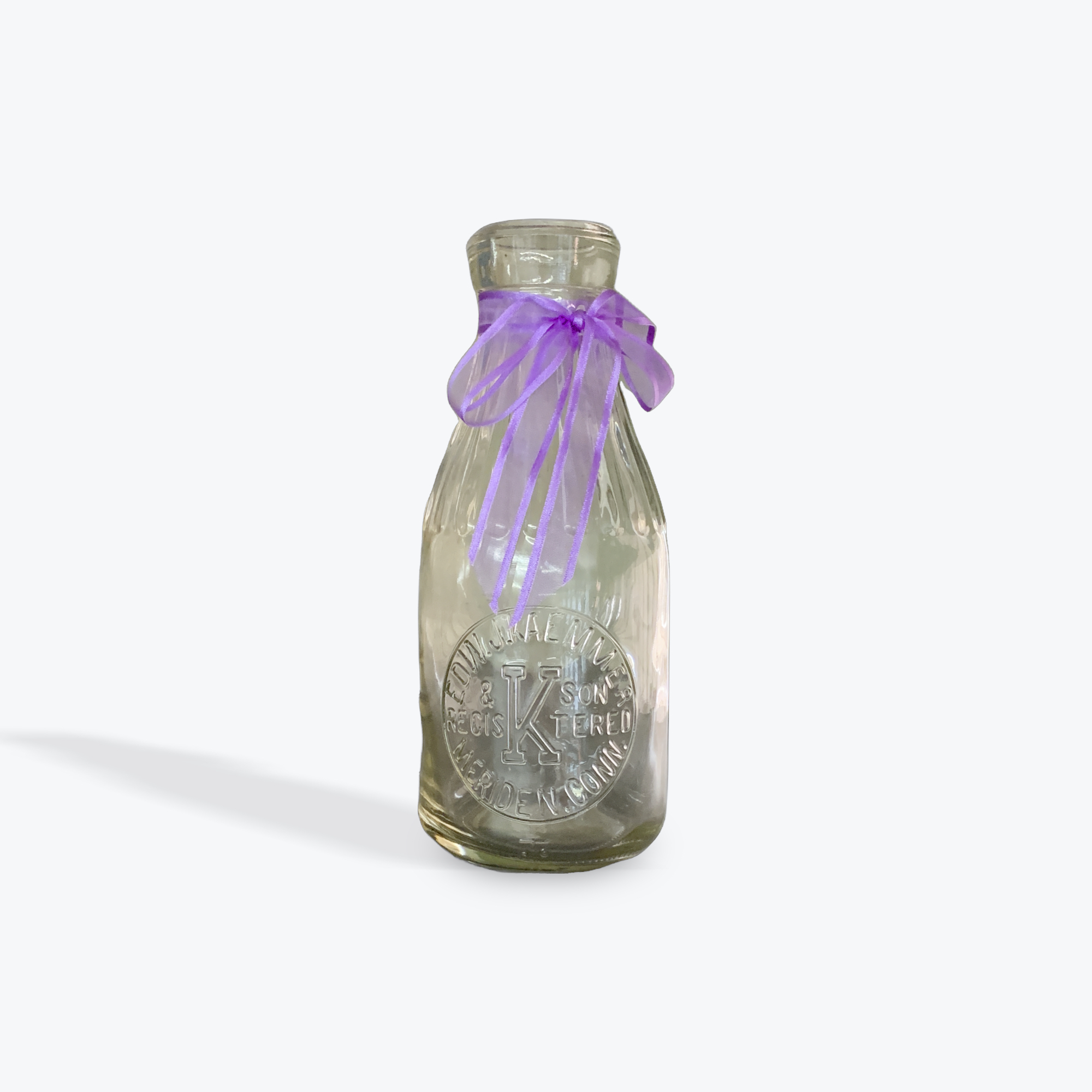 Milk bottle purple ribbon